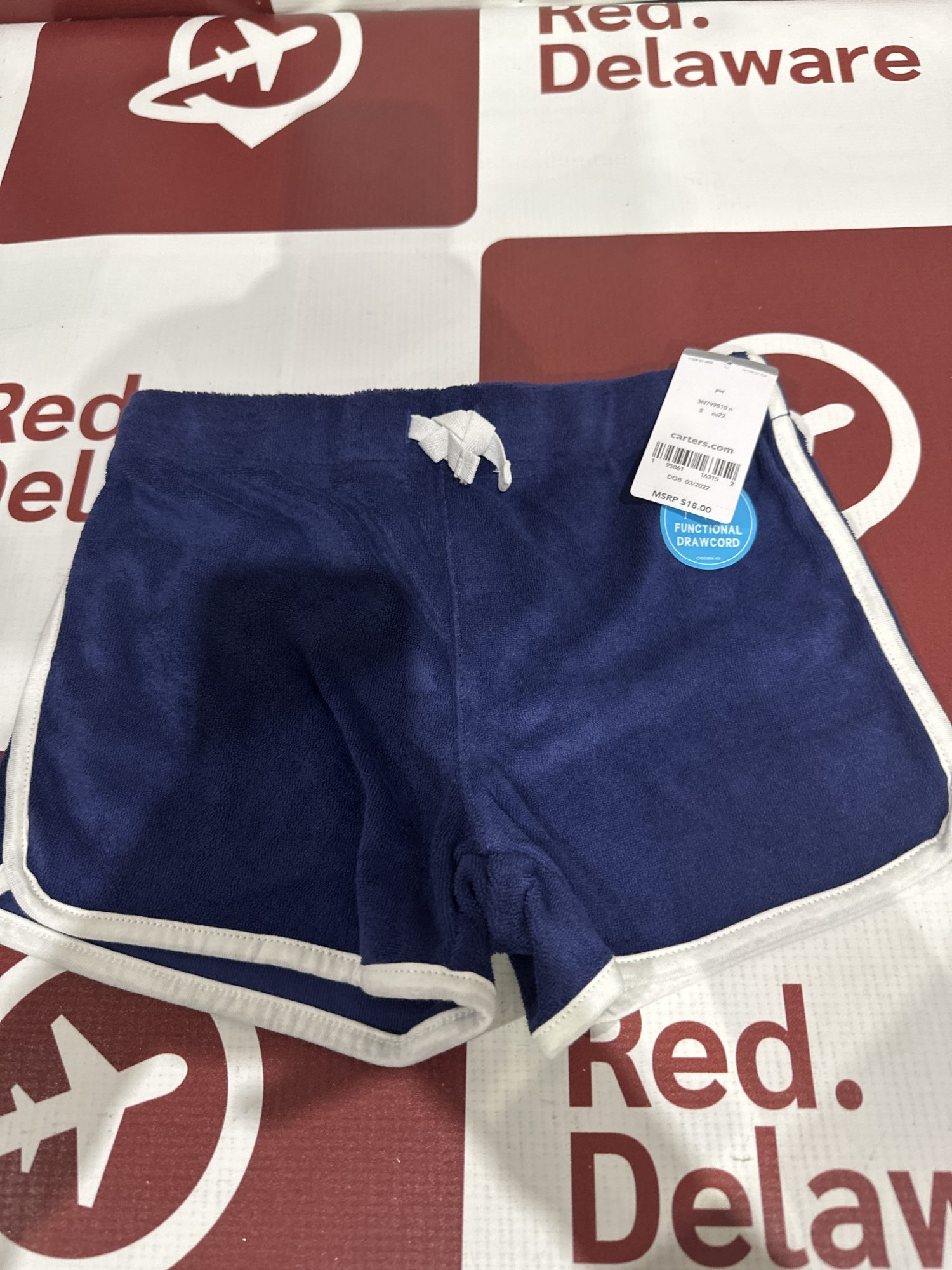 Carter’s short azul (E1)